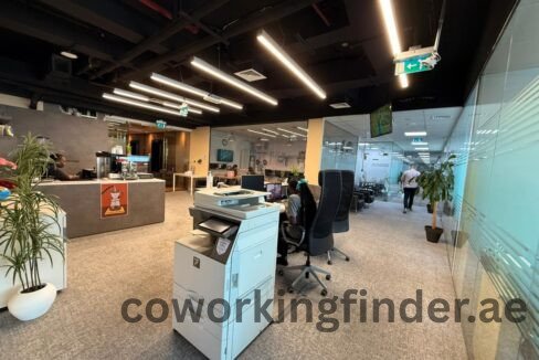 High ceiling coworking office with glass partitions in Dubai