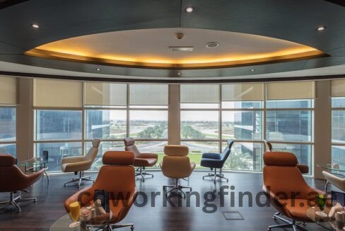 A person checking in at a coworking space reception desk