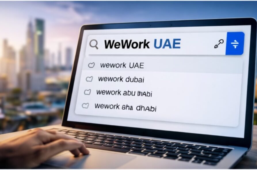 Professional searching WeWork UAE coworking spaces on laptop in Dubai office setting